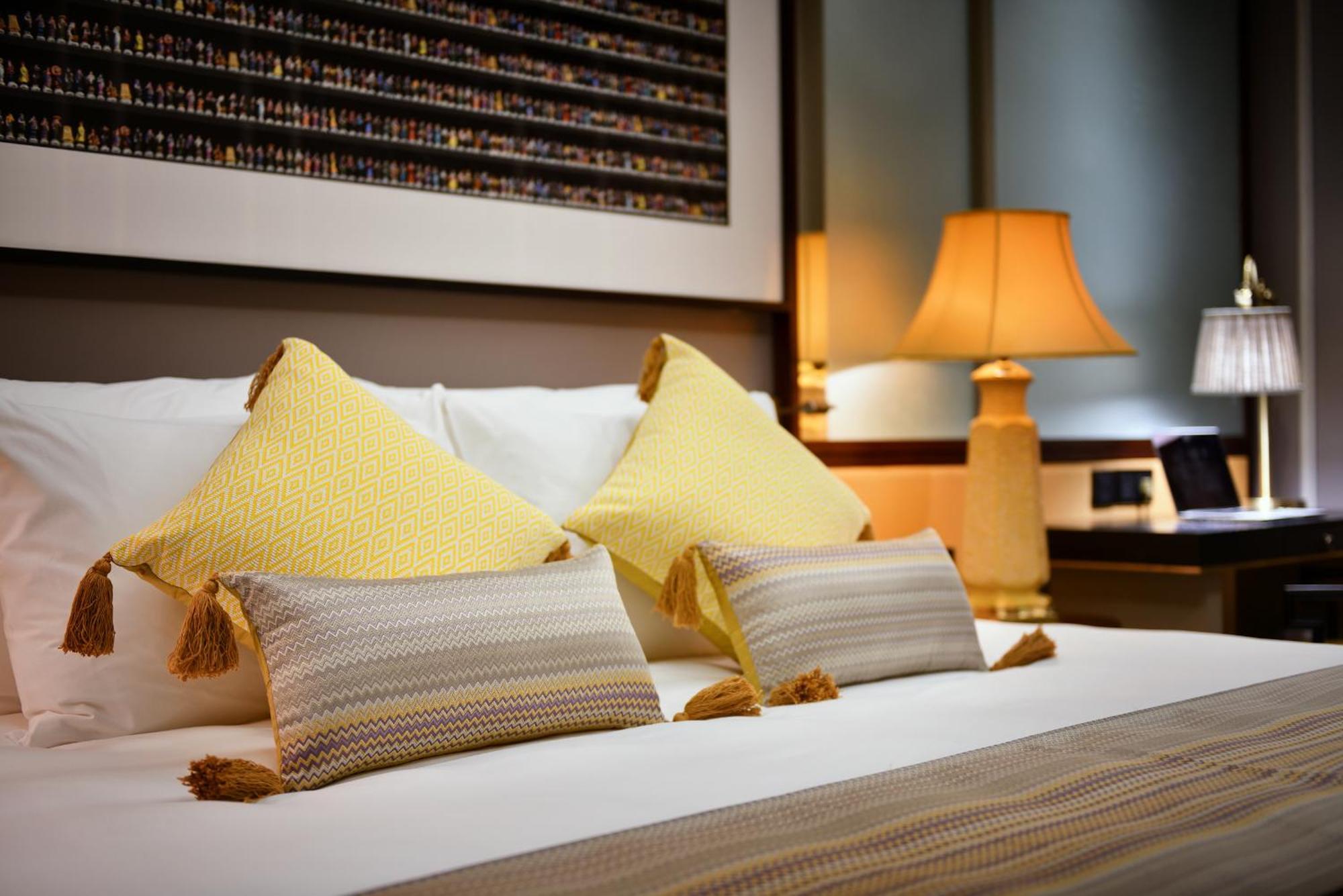 Silk Path Grand Sapa Resort & Spa Exterior photo A bed with cushions